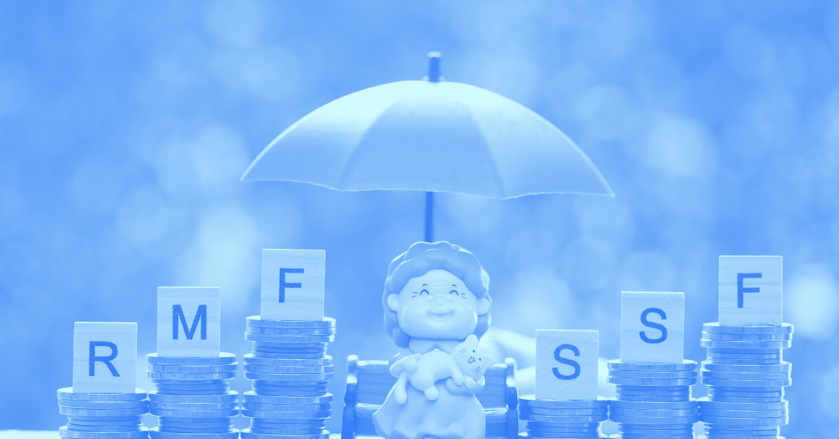 Figurine of elderly woman sitting on a bench with a cat placed in the middle of stacked coins